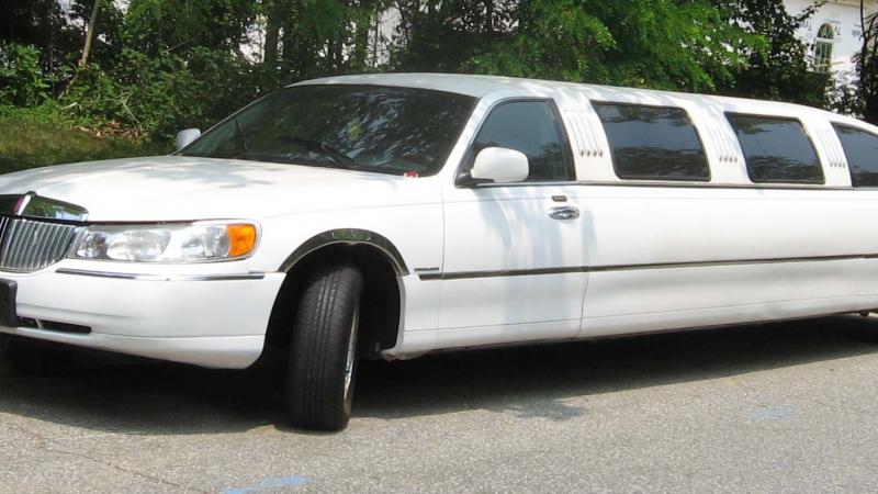 white stretched Lincoln limousine