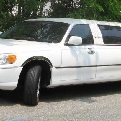 white stretched Lincoln limousine